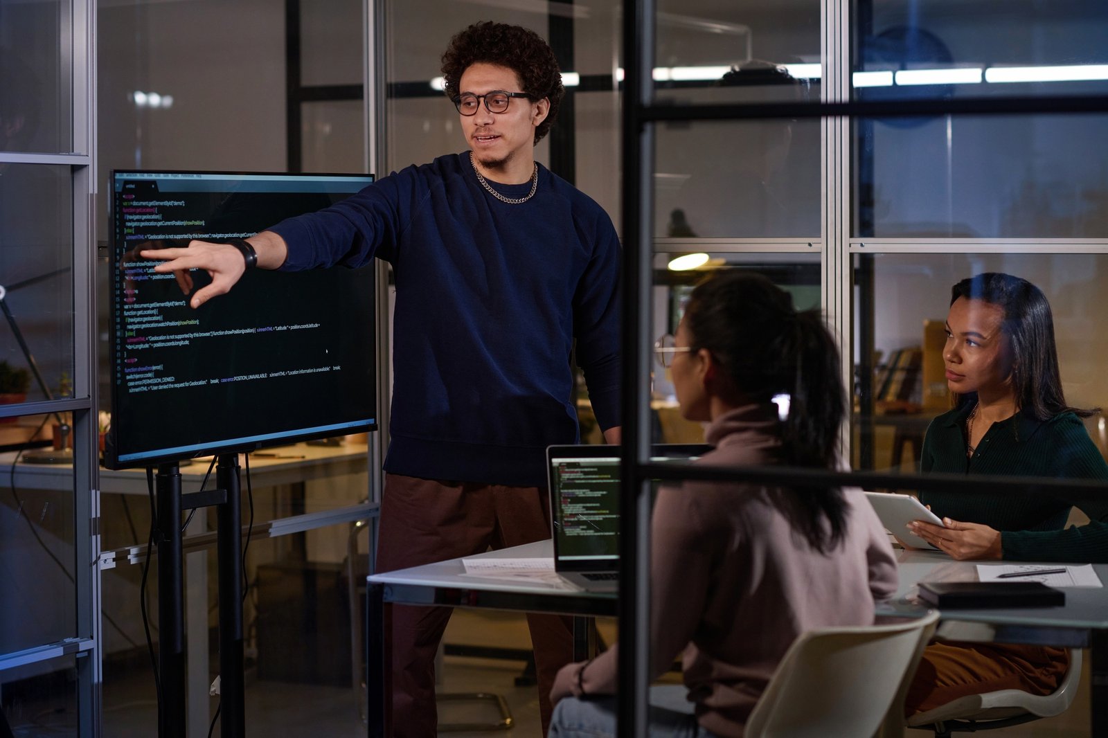 Multi-ethnic Programmers Working In Evening